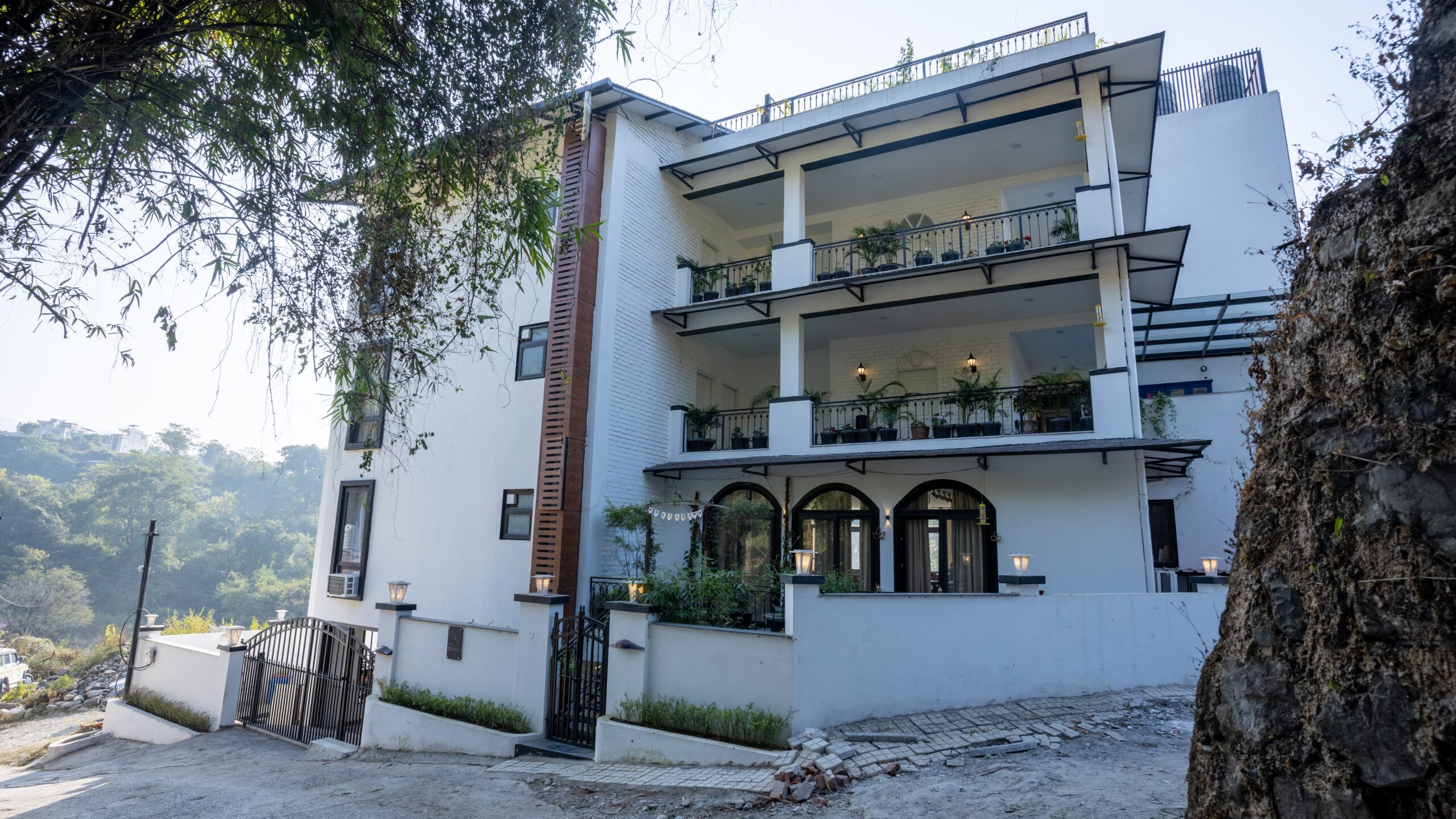 Exterior of the Chakk 109 retreat among trees