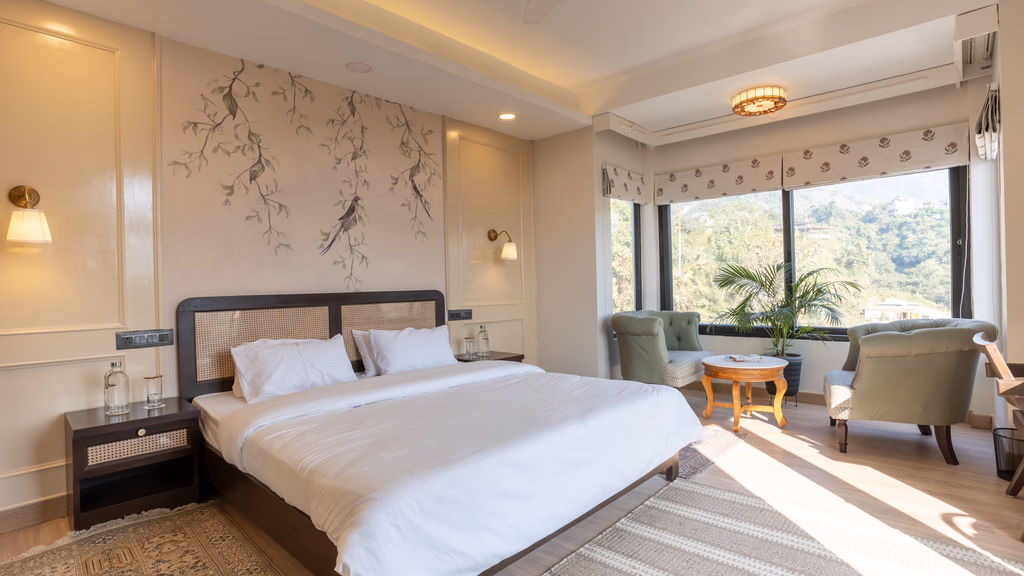 Guest bedroom with patterned walls and a large window